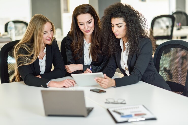 three-businesswomen-working-together-modern-office